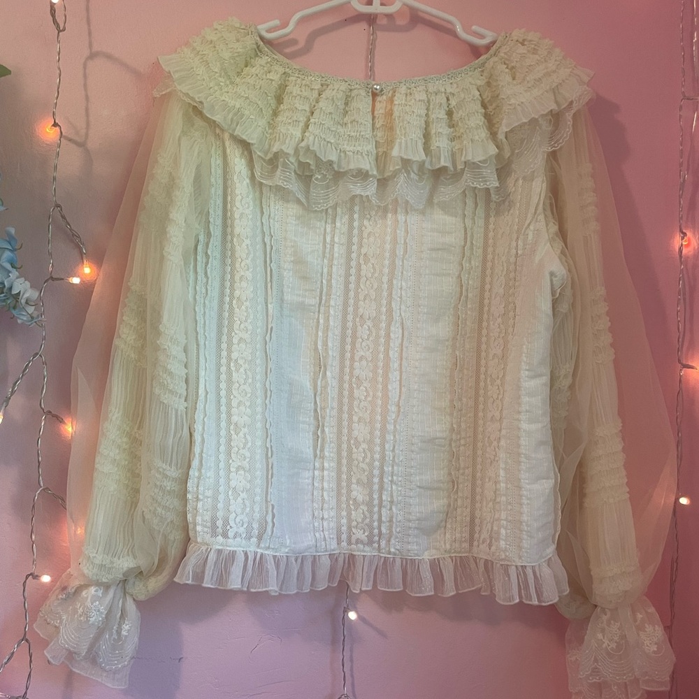 Cream blouse With decorative sleeves frills and lace and collar